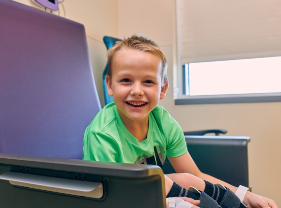 happy kid in chair